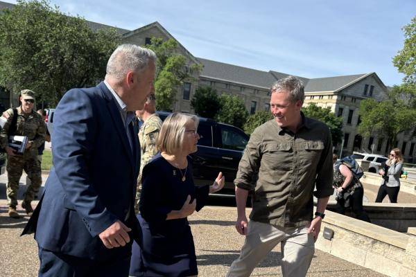 Rep. Eric Sorensen (IL-17) greets Army Secretary Daniel Driscoll at the Rock Island Arsenal with Congresswoman Mariannette Miller-Meeks.