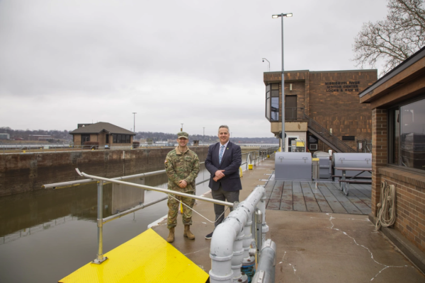 Sorensen poses with US Army Corps of Engineers worker at Rock Island Arsenal in Rock Island, Illinois
