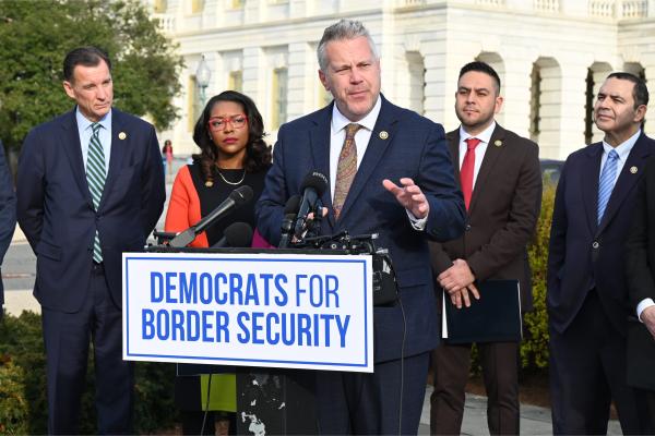 Sorensen Speaks at podium in front of the U.S. Capitol