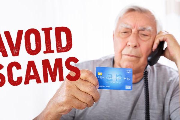 Image that says "Avoid Scams" next to a photograph of a senior citizen reading his credit card information to a scammer