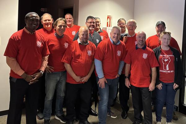 Sorensen with UAW workers and local leaders at picket line event in Belvidere.