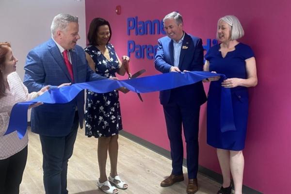 Sorensen cuts the ribbon at a Planned Parenthood