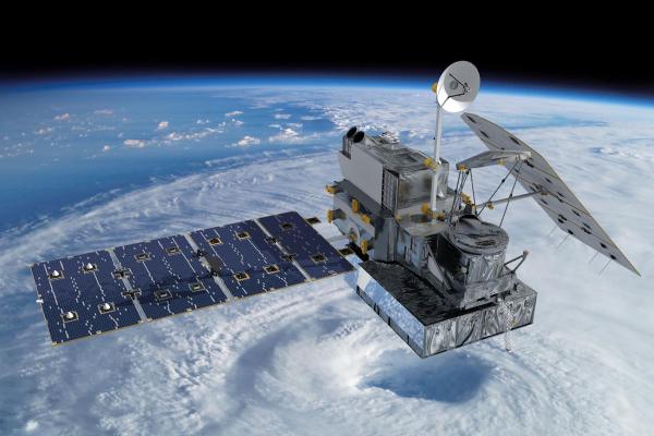 Image of a weather satellite in space over a hurricane on Earth