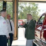 U.S. Rep. Eric Sorensen, D-Rockford (right), speaks with Rock Falls Fire Department Chief Ken Wolf III (center) and Deputy Chief Kyle Sommers on Friday, Aug. 9, 2024.