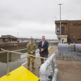 Sorensen poses with US Army Corps of Engineers worker at Rock Island Arsenal in Rock Island, Illinois