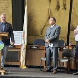 17th District Democratic Congressman Eric Sorensen (left) speaks at an event highlighting federal funding for a Peoria Heights water infrastructure project, as Director of Community Development Wayne Aldrich (middle) and mayor Mike Phelan (left) listen.