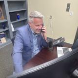 Rep. Eric Sorensen (IL-17) answers and speaks on the phone during a telephone town hall he hosted. 