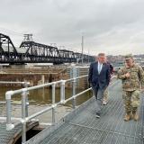 Congressman Sorensen walking with armed service member